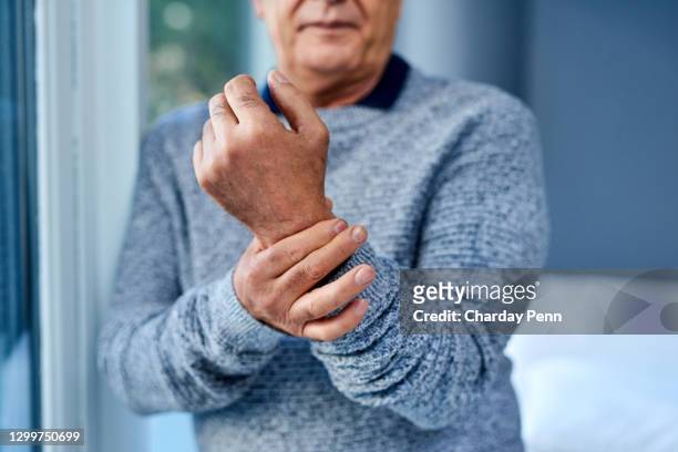a bit of inflammation can cause a lot of pain - arthritic hands stock pictures, royalty-free photos & images