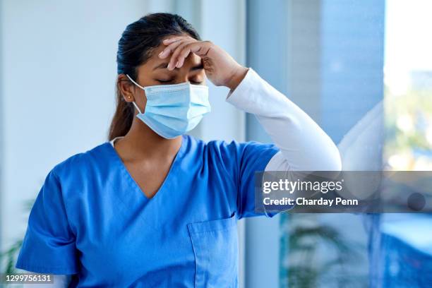 the risk of frontline worker stress is real - medical mistake stock pictures, royalty-free photos & images