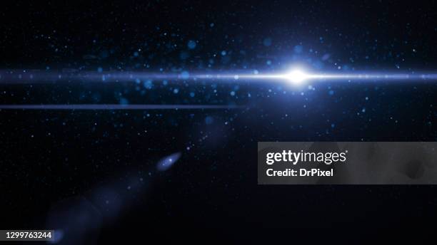 light with lens flare and defocused lights and glowing particles - instrumento óptico fotografías e imágenes de stock