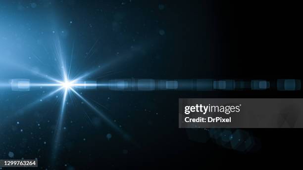 light with lens flare and dust particles - igniting photos et images de collection