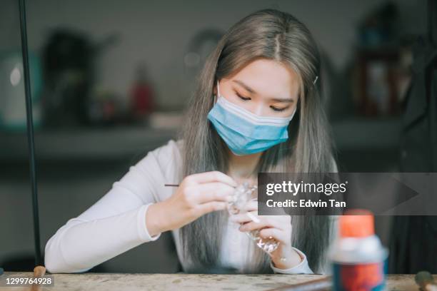 asian chinese female college student side by side crafting jewelry design at workbench - polishing stock pictures, royalty-free photos & images