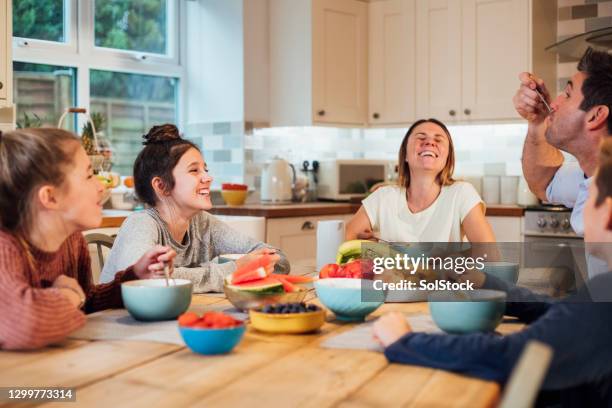 breakfast with family - teenager eating stock pictures, royalty-free photos & images