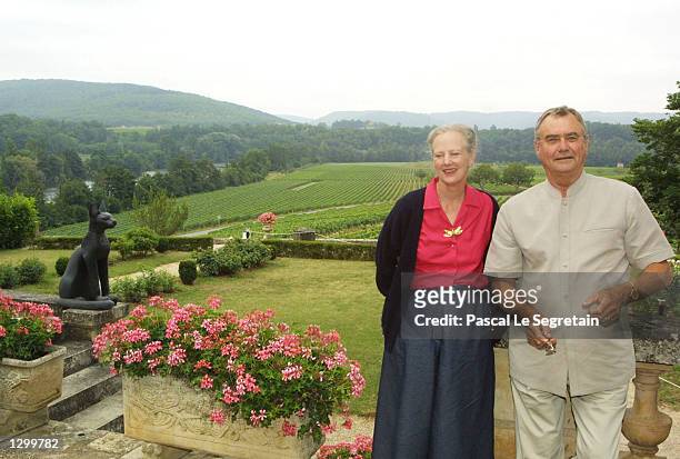 Queen Margrethe of Denmark and Prince Henrik stand on the grounds of their Castle of Caix August 8, 2002 in the village of Caix in southwestern...