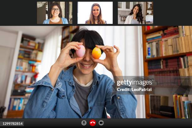 happy woman celebrating easter in video call with friends - funny easter stock pictures, royalty-free photos & images