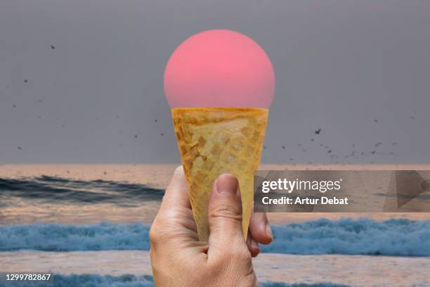creative picture of ice cream cone matching with big sunset sun. - dream big stockfoto's en -beelden