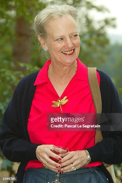 Queen Margrethe of Denmark stands on the grounds of her Castle of Caix August 8, 2002 in the village of Caix in southwestern France. The queen will...