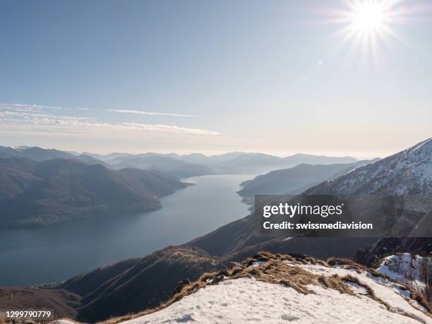 view from mountain top of lake maggiore in switzerland. stunning view of locarno and ascona from high mountain to - lake maggiore stock pictures, royalty-free photos & images