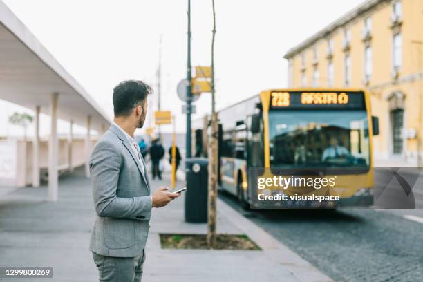 businessman taking a bus after work - aeroporto lisboa imagens e fotografias de stock