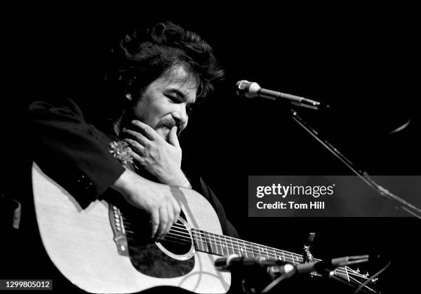 Singer-songwriter John Prine performs at Symphony Hall on April 26, 1974 in Atlanta, Georgia.