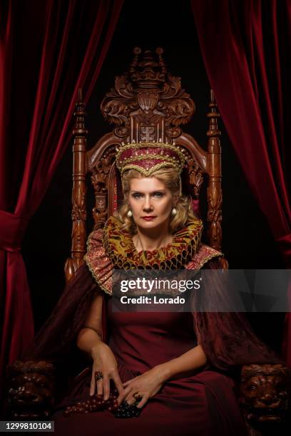 historical queen character on the throne - queen throne stock pictures, royalty-free photos & images