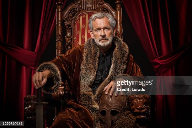 historical king in studio shoot - man throne stock pictures, royalty-free photos & images