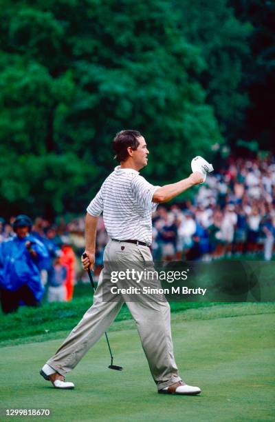 Davis Love III of the USA raises his cap on the 18th green after winning the US PGA Golf Championship at Winged Foot Golf Club July 17th, 1997 in...