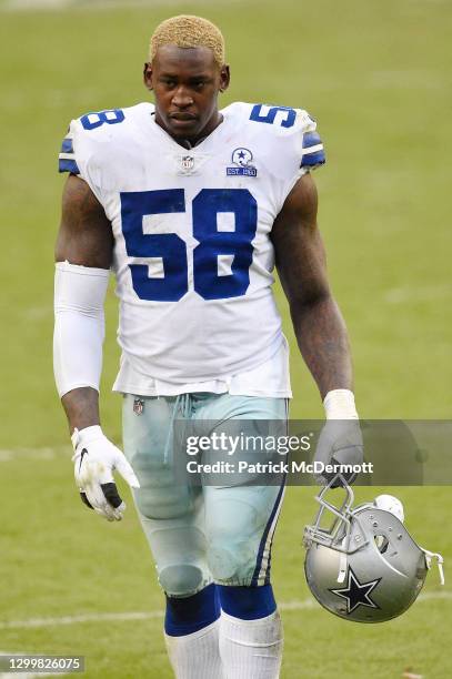 Aldon Smith of the Dallas Cowboys walks off the field after their 25-3 loss against the Washington Football Team at FedExField on October 25, 2020 in...