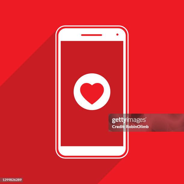 red heart play button smart phone - video play button stock illustrations