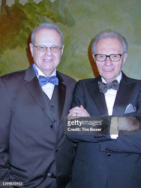 Portrait of American brothers, lawyer Martin Zeiger and television & radio host Larry King as they pose together at an unspecified event, New York,...
