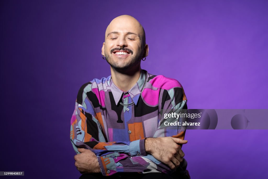 Stylish bald man feeling happy