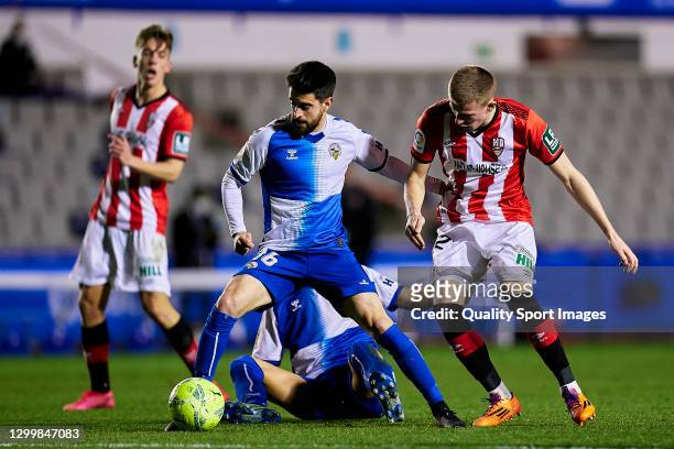 Xavi Boniquet of CE Sabadell competes for the ball with Mateusz Bogusz of UD Logrones during the Liga Smartbank match betwen CE Sabadell and UD...