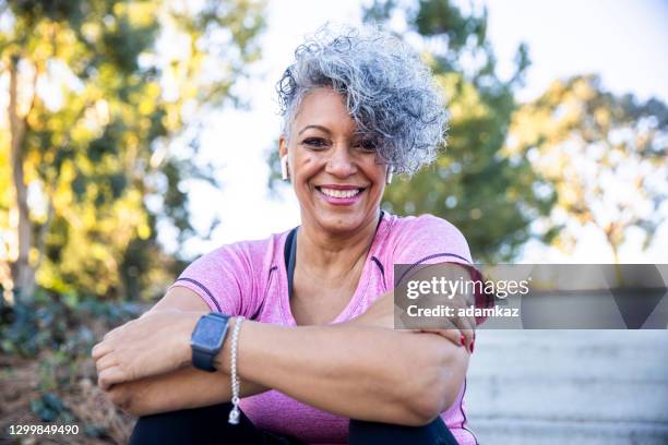 portrait of a black woman - active senior woman imagens e fotografias de stock