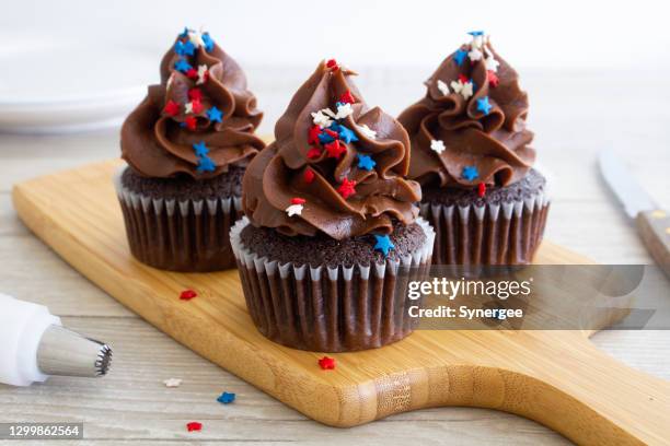 chocolate cupcakes with star sprinkles - jimmy v classic stock pictures, royalty-free photos & images