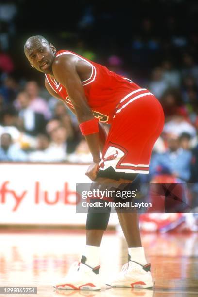 Michael Jordan of the Chicago Bulls dunks the ball during a NBA basketball game against the Washington Bullets at the Capital Centre on December 14,...