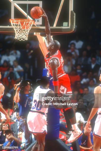 Michael Jordan of the Chicago Bulls dunks the bal during a NBA basketball game against the Washington Bullets on November 3, 1990 at Capital Centre...