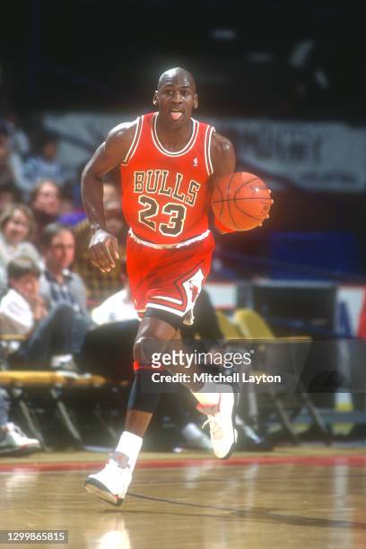 Michael Jordan of the Chicago Bulls dribbles up court during a NBA basketball game against the Washington Bullets on November 3, 1990 at Capital...