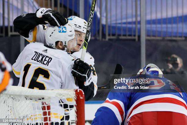 Jason Zucker celebrates with Kasperi Kapanen of the Pittsburgh Penguins after scoring a goal during the first period against the New York Rangers at...