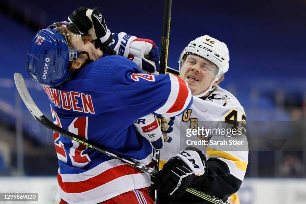 Kasperi Kapanen of the Pittsburgh Penguins fights Brett Howden of the New York Rangers during the first period at Madison Square Garden on February...