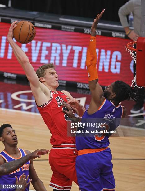 Lauri Markkanen of the Chicago Bulls goes up for a shot against Nerlens Noel of the New York Knicks at the United Center on February 01, 2021 in...