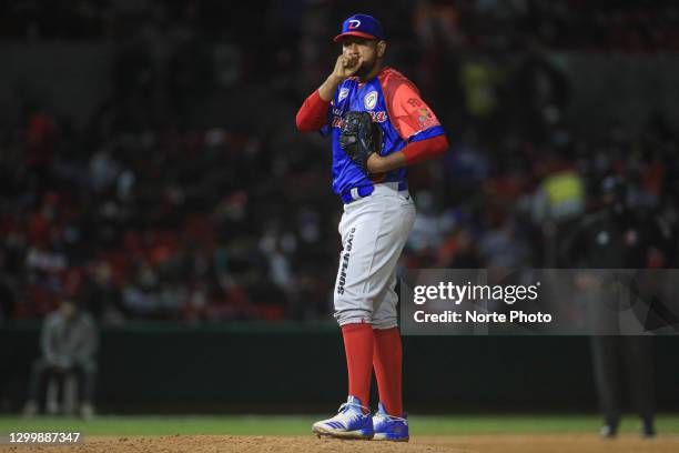 Cesar Valdez of Las Águilas Cibaeñas of the Dominican Republic prepares to pitch in the first inning during the game between Dominican Republic and...