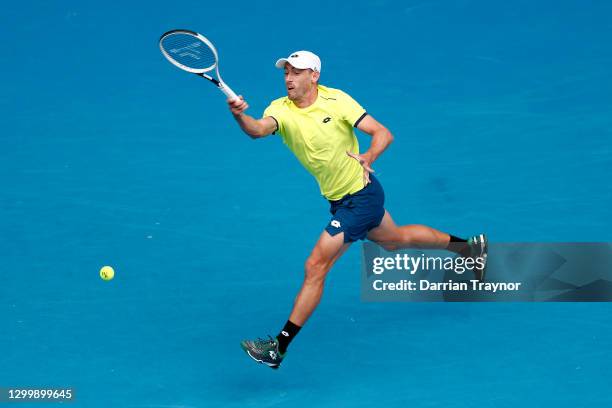 John Millman of Australia plays a forehand in his Group B singles match against Pablo Carreno Busta of Spain during day one of the 2021 ATP Cup at...