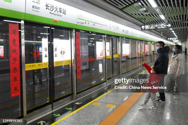 Pair of Spring Festival couplets are seen on the platform screen door of a metro station to welcome the upcoming Chinese New Year, the Year of the...