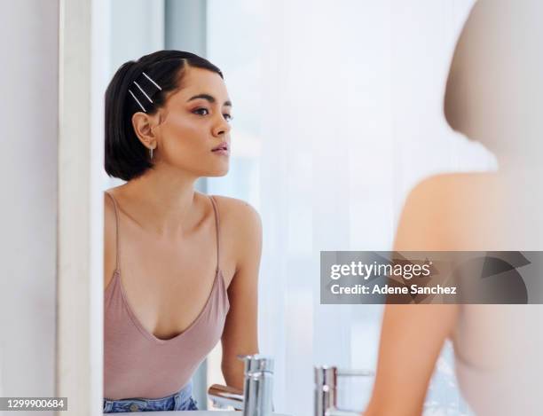 what makes you glow makes you gorgeous - girl in mirror stock pictures, royalty-free photos & images