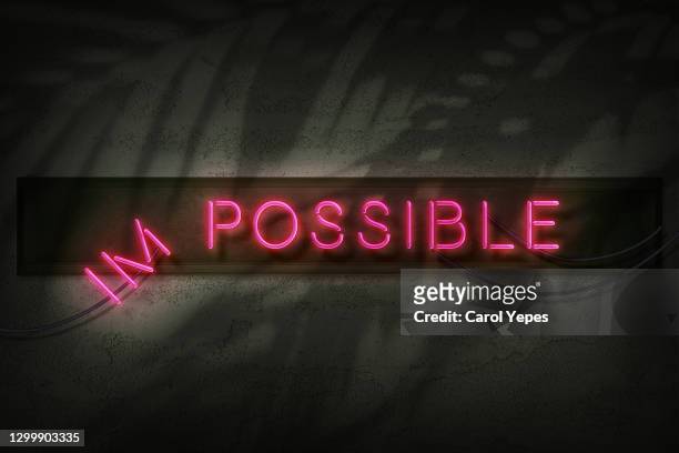impossible/possible message in neonstyle - atitude stock pictures, royalty-free photos & images