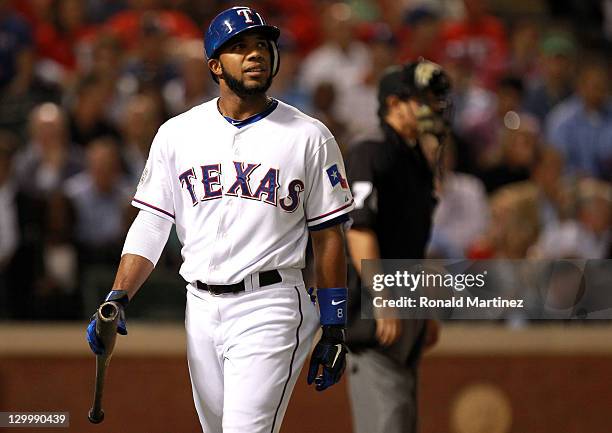 Elvis Andrus of the Texas Rangers reacts after striking out in the first inning during Game Three of the MLB World Series against the St. Louis...