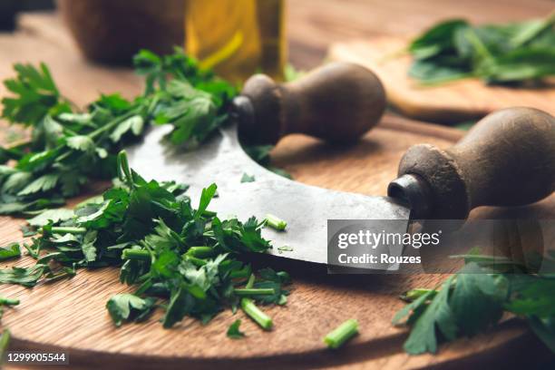 fresh parsley on wooden table - mincing knife stock pictures, royalty-free photos & images
