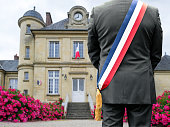A mayor in front of his town hall