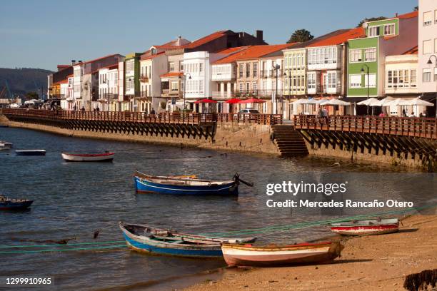 mugardos village , waterfront promenade, beach and fishing boats. - corunna stock pictures, royalty-free photos & images