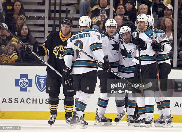 Benn Ferriero of the San Jose Sharks is congratulated by teammates Jim Vandermeer,Jamie McGinn and Michal Handzus after Ferriero scored the game...