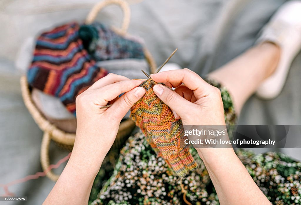 Woman hands knitting close-up hobby, leisure activity, handmase socks, wool