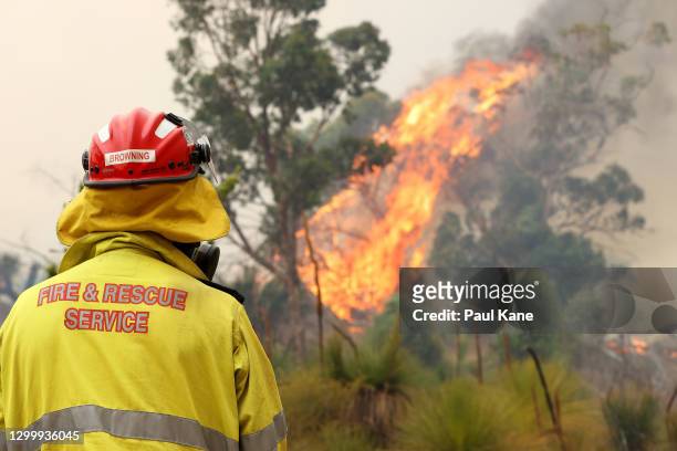 Member of the Fire & Rescue Service watches an approaching bush fire at Copley Road in Upper Swan on February 02, 2021 in Perth, Australia. The Rapid...