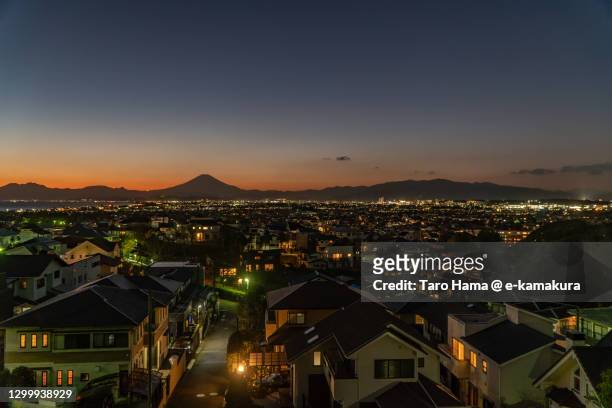 mt. fuji and the residential district by the sea in kanagawa prefecture of japan - chigasaki stock pictures, royalty-free photos & images