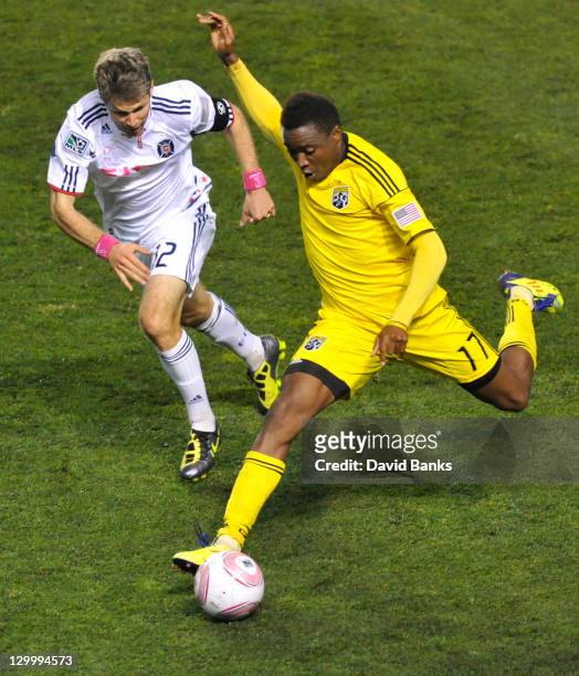 Logan Pause of the Chicago Fire and Emmanuel Ekpo of the Columbus Crew vie for the ball during an MLS match on October 22, 2011 at Toyota Park in...