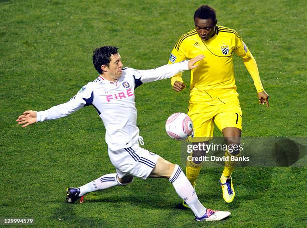 Dan Gargan of the Chicago Fire and Emmanuel Ekpo of the Columbus Crew vie for the ball during an MLS match on October 22, 2011 at Toyota Park in...