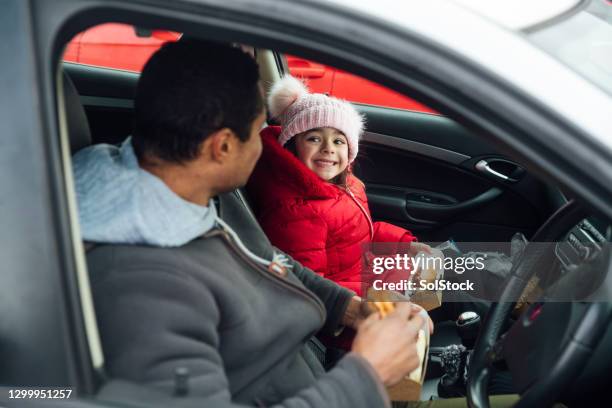 lunch on the go - daughter car stock pictures, royalty-free photos & images