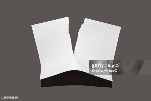torn paper on brown - separation foto e immagini stock