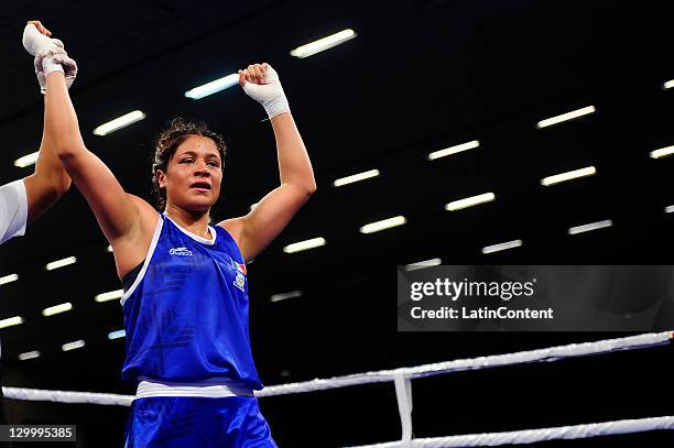 Erika Cruz of Mexico celebrates his victory against Adriana Araujo of Brazil during the Woman's Light Welter 57-60 kg in the 2011 XVI Pan American...