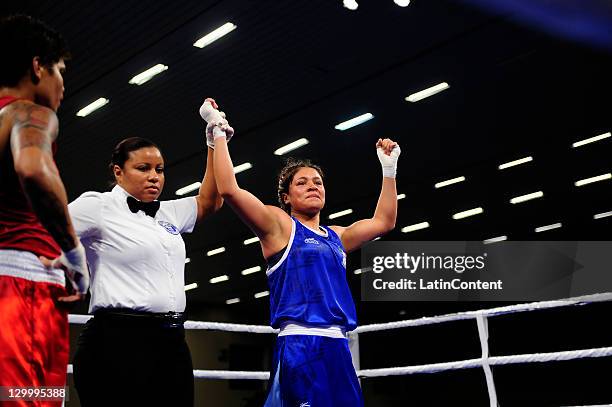 Erika Cruz of Mexico celebrates his victory against Adriana Araujo of Brazil during the Woman's Light Welter 57-60 kg in the 2011 XVI Pan American...