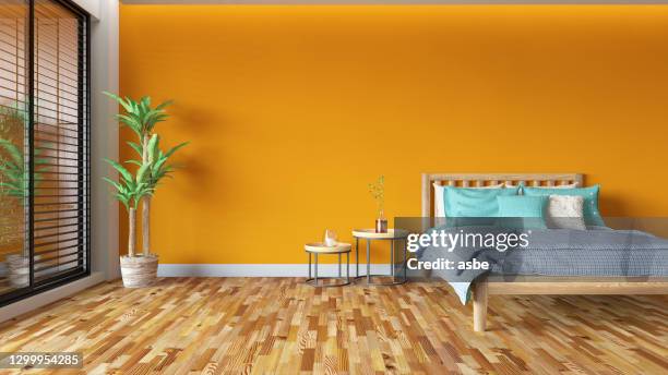 oranje slaapkamer ontwerp - bright bedroom stockfoto's en -beelden