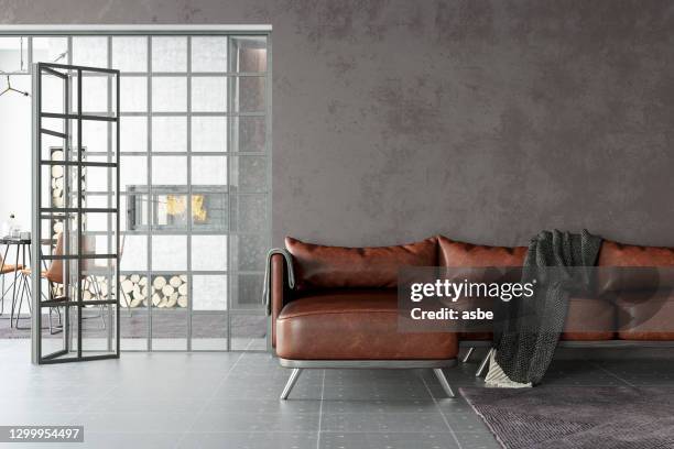 leather sofa with empty gray wall - leather couch stock pictures, royalty-free photos & images